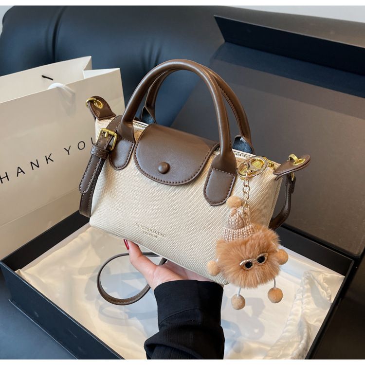 Borse da donna La borsa a forma di gnocco semplice più popolare di quest'anno, la nuova borsa a tracolla a tracolla Xiang Longbags di alta qualità con trama a mano_voghion.com