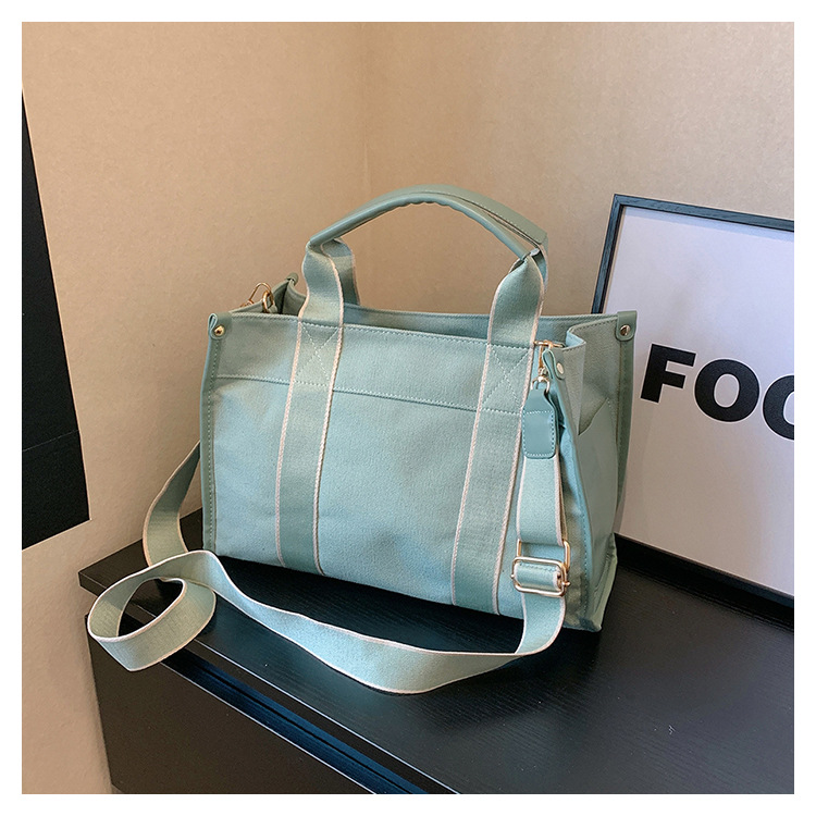 Japan and South Korea Foreign Trade Canvas Bag Women 2023 New Trendy Fashion handbag niche hit color commuting shoulder Messenger bag_voghion.com
