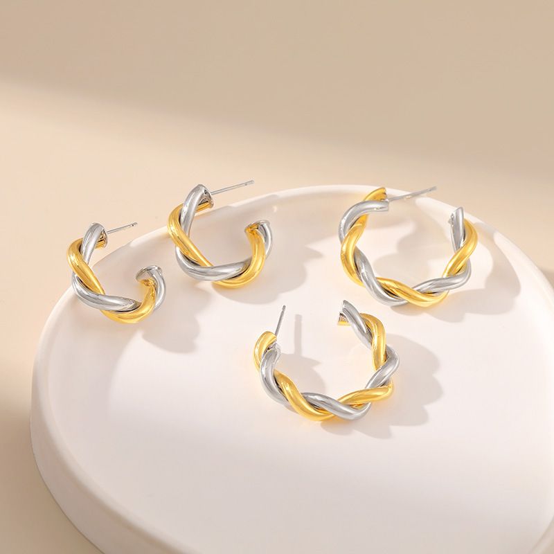 Gold and silver contrasting design personality earrings K real gold plated niche metal texture cross twist earrings_voghion.com