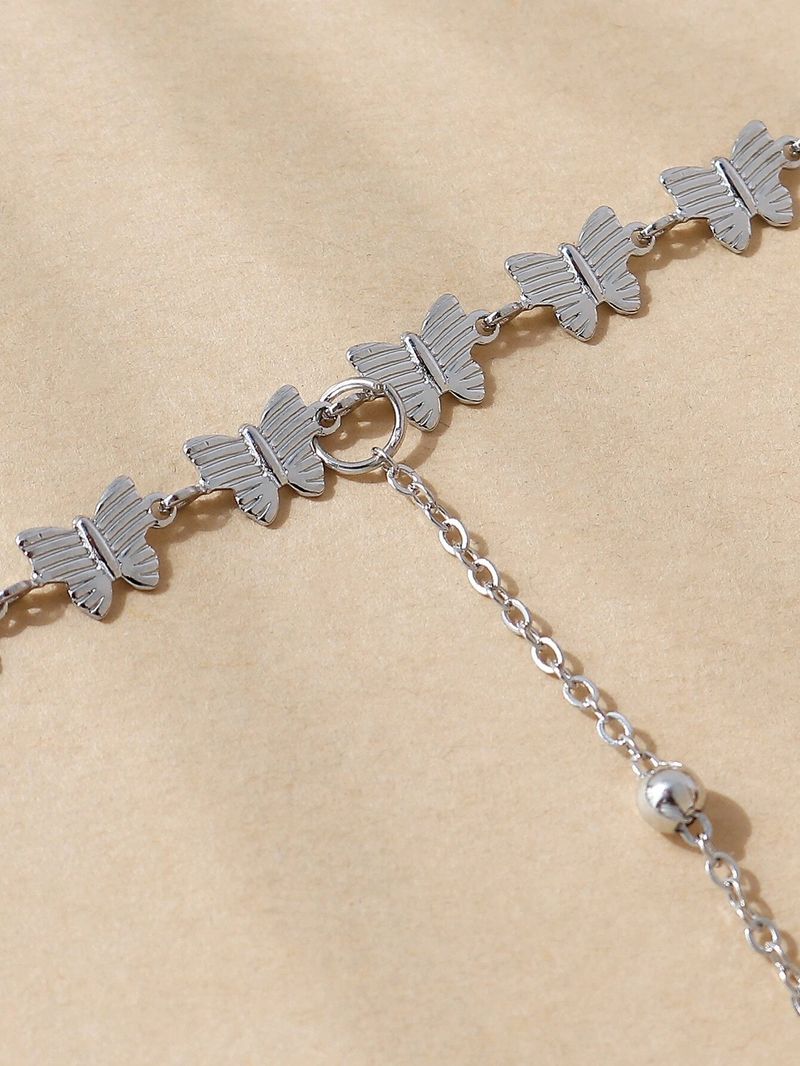 Cavigliera semplice estiva con piccola farfalla, accessorio versatile per le vacanze al mare da donna_voghion.com