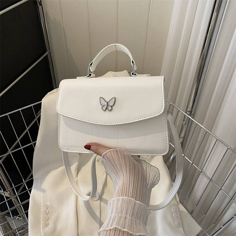 Fransk lyxig handväska i mild stil Butterfly Dekorativ liten väska Dam 2024 Sommar Ny västerländsk stil Crossbody-väska med en axel_voghion.com