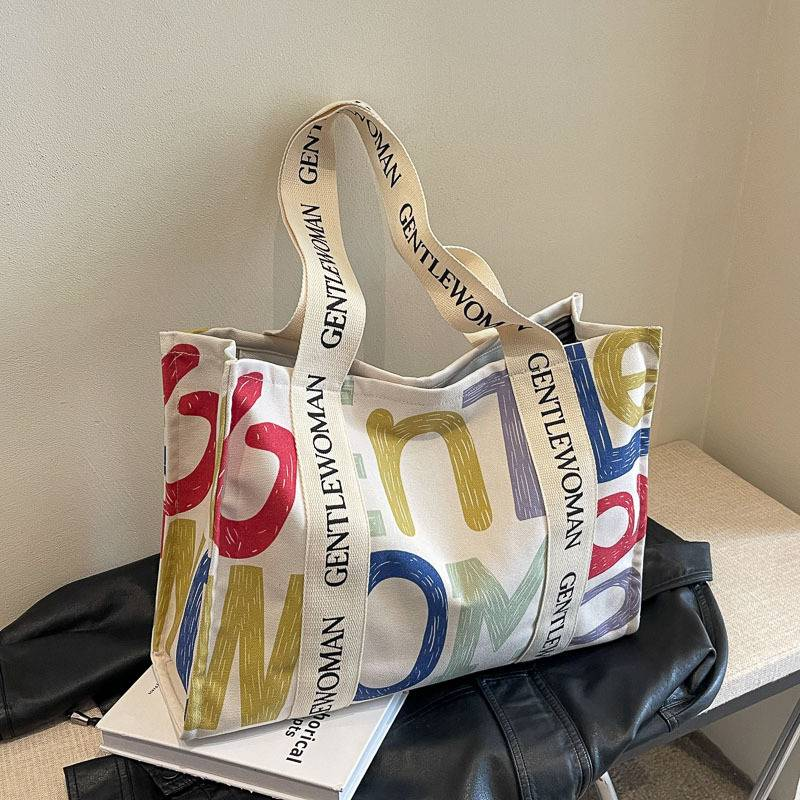 Bolso de lona a la moda para mujer, bolso grande de hombro con borla y letras, material vaquero, bolso de compras de gran capacidad para mujer_voghion.com