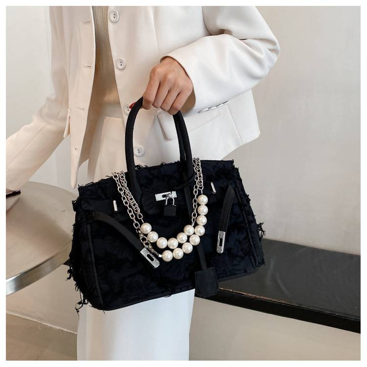 A niche design pearl women's chain bag with a new vintage rag beggar platinum single shoulder crossbody light luxury handbag_voghion.com