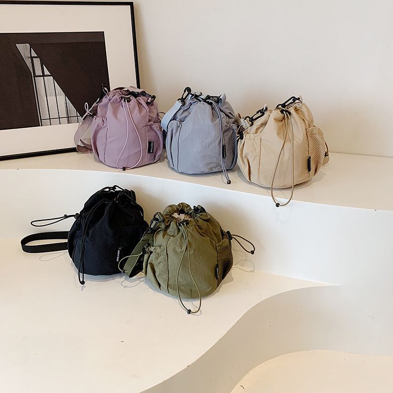 Borsa a secchiello piccola in tessuto casual e versatile da donna, stile coreano, nuova, a tracolla, con tracolla singola, di nicchia_voghion.com