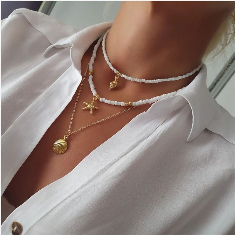 2025 Nouveautés Vintage Bleu Blanc Perle Chaîne Oeil Étoile De Mer Tête Pièce Pendentif Collier Pour Femmes Boho Mode Ethnique Multicouche Baroque_voghion.com