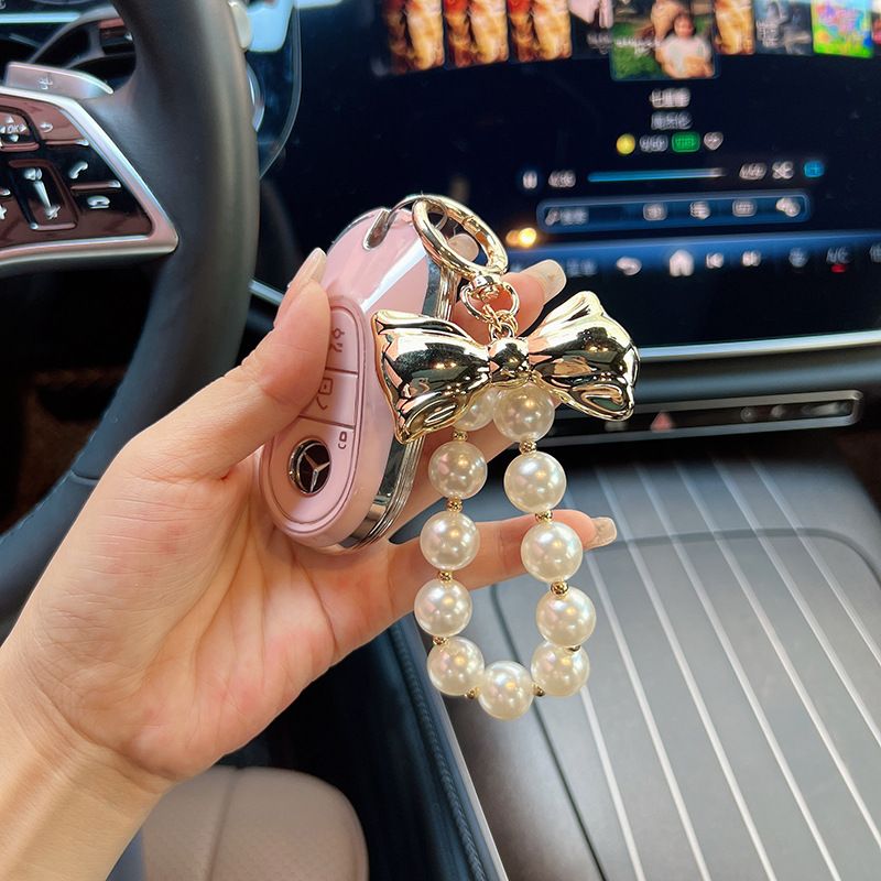 Versione coreana, ciondolo con perline di alta qualità, design di nicchia in oro e argento, papillon, accessori per borse, portachiavi per auto, decorazione_voghion.com