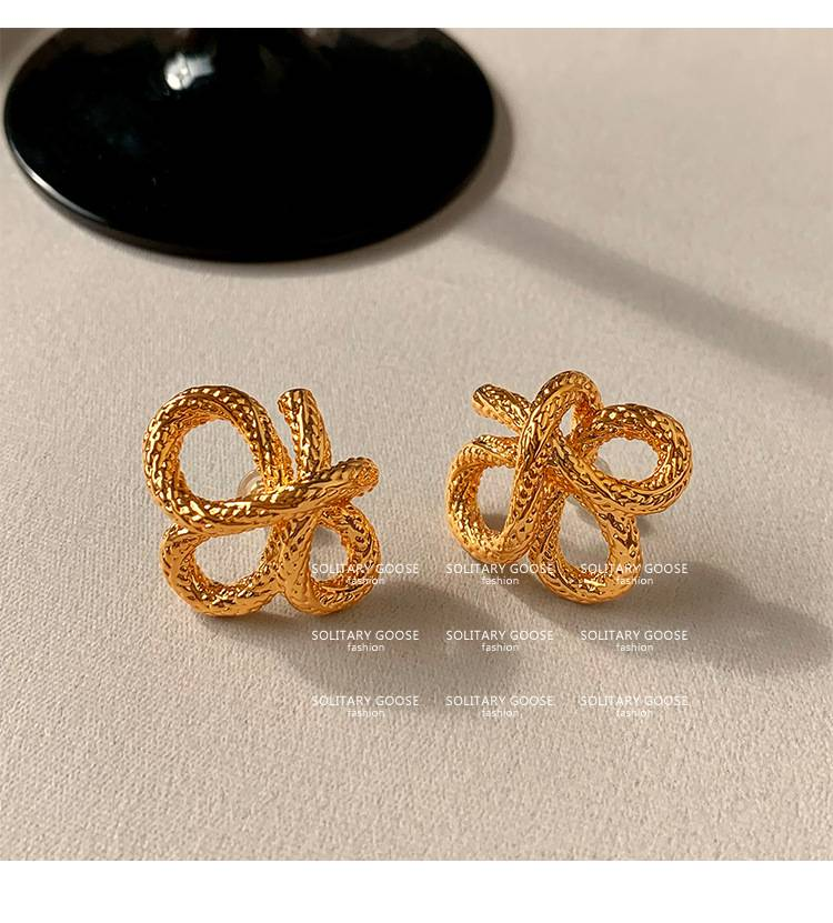 2024 new personality niche design earrings European and American French knotted twist gold earrings_voghion.com