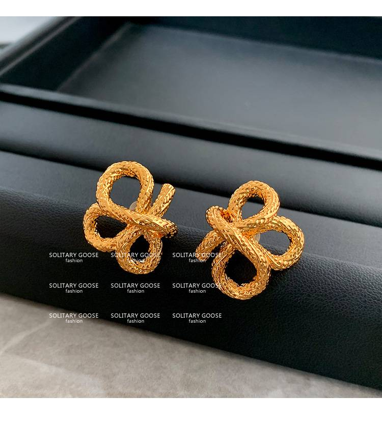 2024 new personality niche design earrings European and American French knotted twist gold earrings_voghion.com
