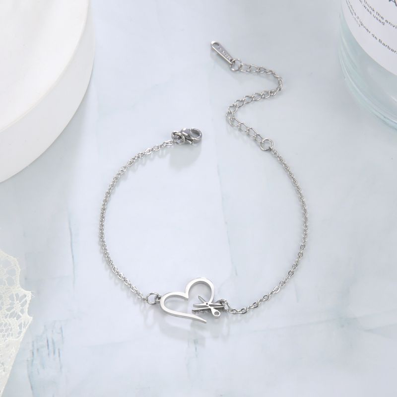Stainless steel bracelet creative design sense of love hair tool pendant bracelet jewelry_voghion.com
