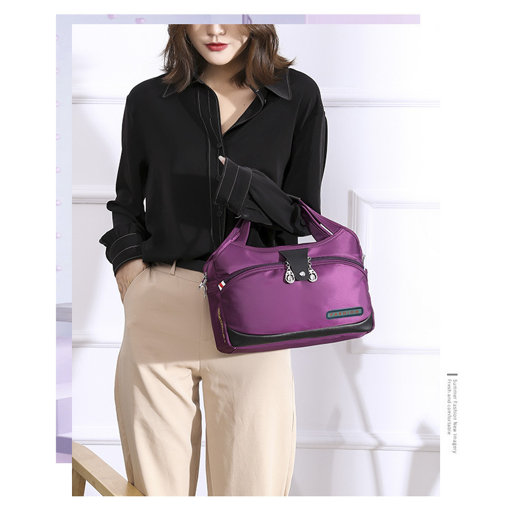 Modern och lätt Oxfordtyg Koreansk version Dam Casual Stor Kapacitet Vattentät Rese Shopping Handhållen Axelväska Crossbody_voghion.com