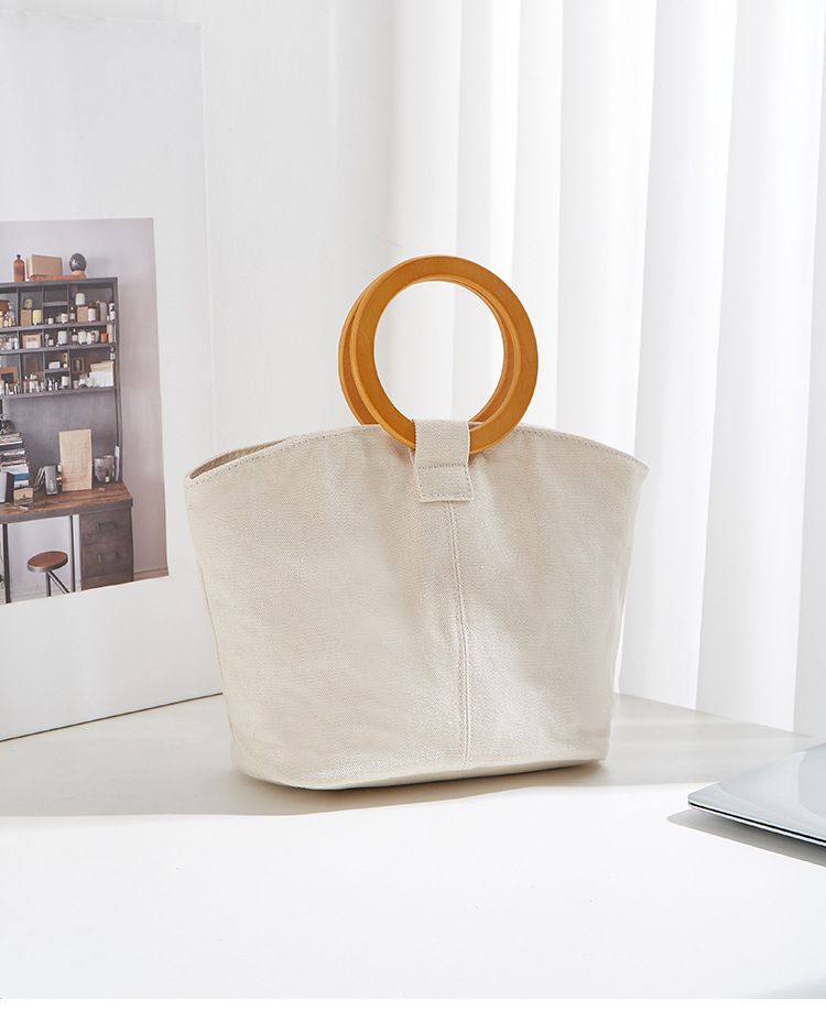 Borsa versatile e di grande capienza in versione coreana, la nuova borsa da donna minimalista in tela di quest'anno, manico in legno_voghion.com
