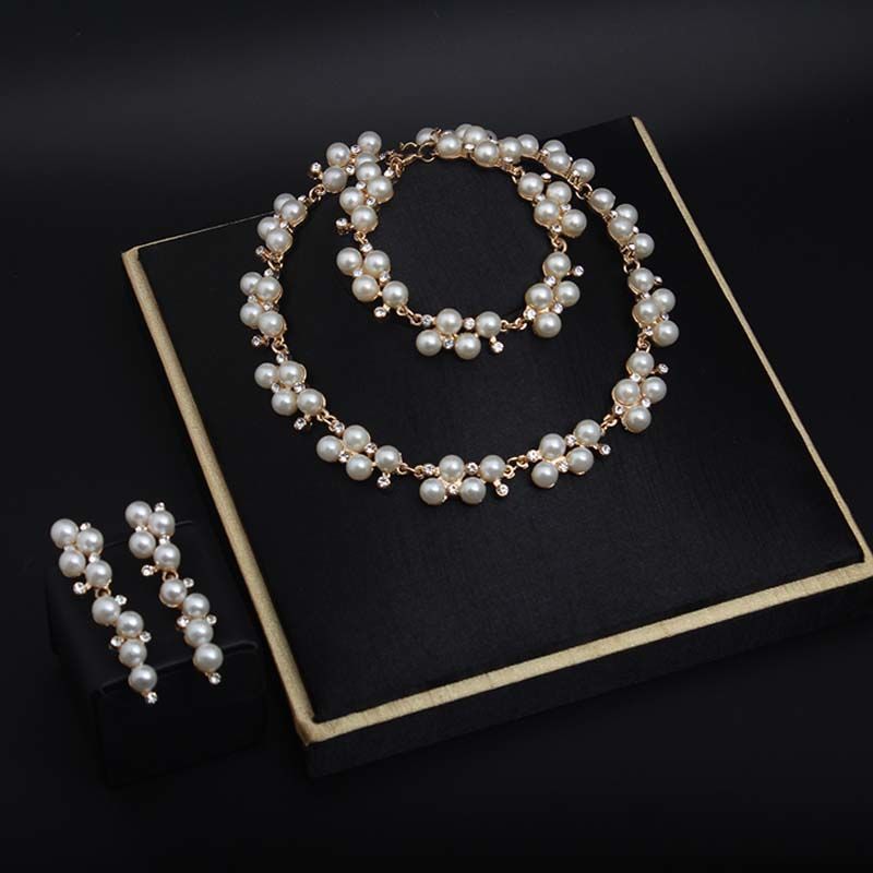 Fashion pearl rhinestone short collarbone necklace earrings bracelet three piece set Korean version versatile feminine_voghion.com
