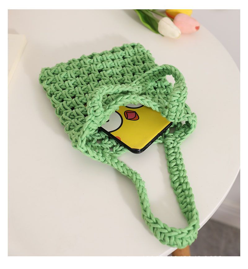 Borsa in tessuto cavo a mano di vendita calda transfrontaliera nuova borsa da donna fatta a mano in filo di cotone legato a mano in tinta unita borsa versatile in paglia con motivo a rete_voghion.com