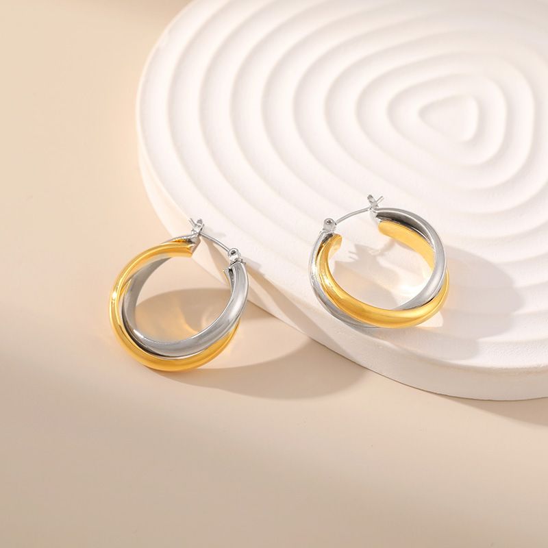 Gold and silver contrasting design personality earrings K real gold plated niche metal texture cross twist earrings_voghion.com