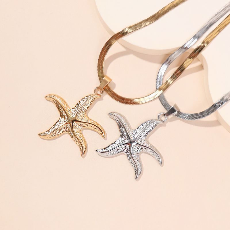 Collar con colgante de estrella de mar fabricado en acero inoxidable._voghion.com