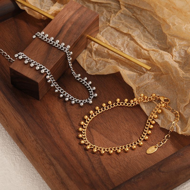 Bracciale con perline rotonde esagerate in stile esotico alla moda per donna con design a nappa, gioielli in acciaio al titanio_voghion.com