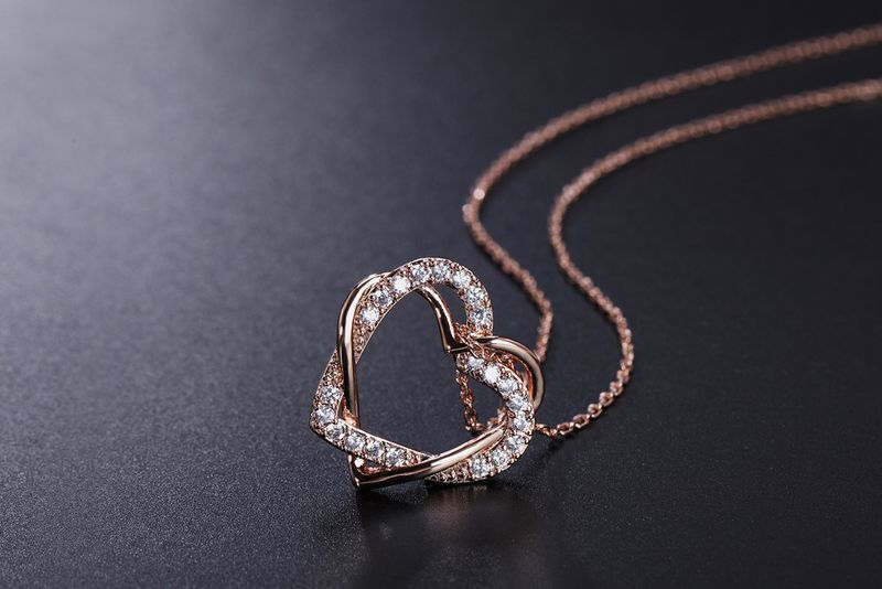 Set di gioielli da donna, orecchini e collana a forma di cuore alla moda, set di gioielli con zirconi micro intarsiati placcati in oro vero_voghion.com