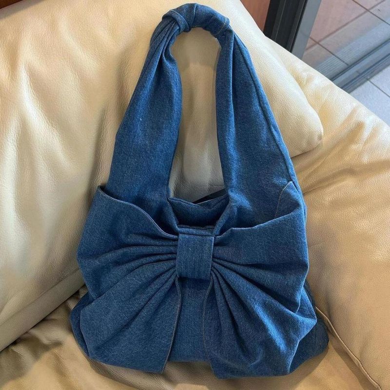 Eenvoudige denim schoudertas met delicate strik, niche forensenhandtas_voghion.com
