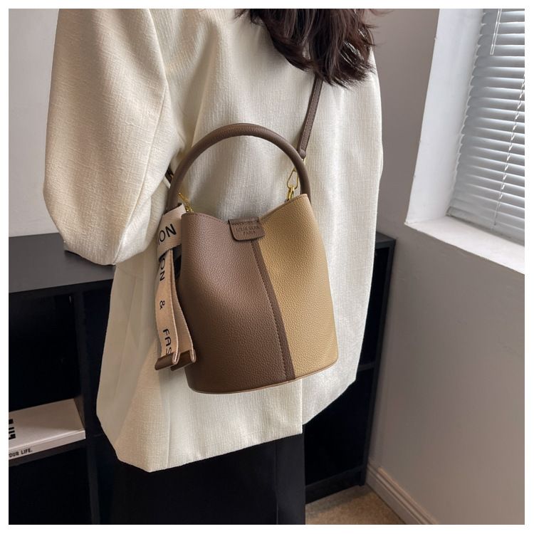 New portable bucket bag with niche design, women's color blocked crossbody bag with high aesthetic value, underarm shoulder bag_voghion.com