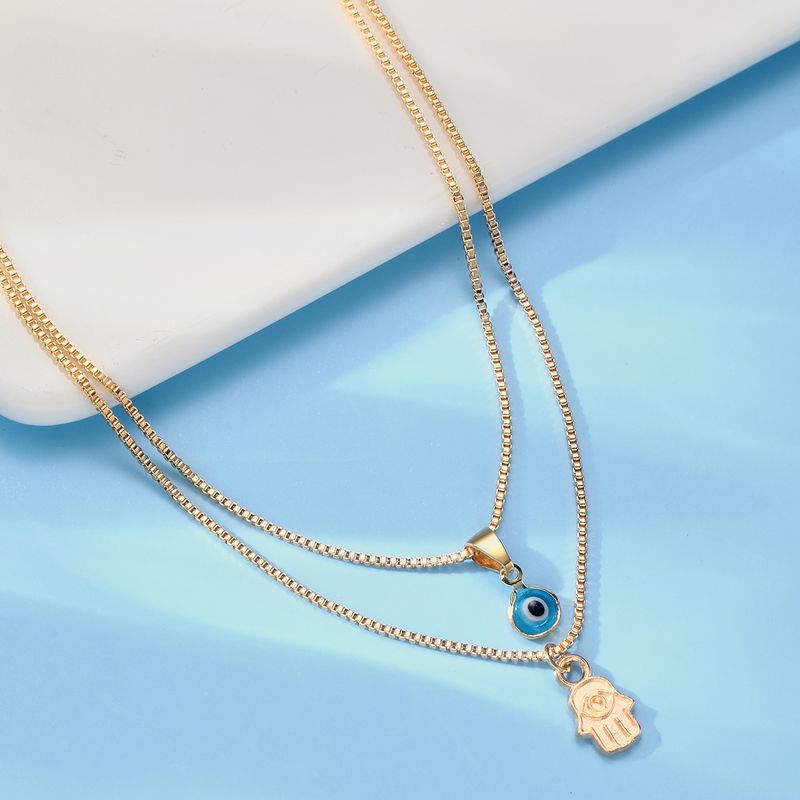 Tyrkisk heldig dobbelthåndskjede og ondt øye-anheng for damer med mini metallkjede-smykker som gave_voghion.com