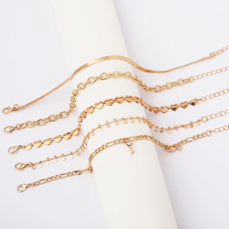 Tobillera de 5 piezas con colgante de borla y llave de diamantes incrustados con cadena de serpiente redonda de corazón hueco estilo punk_voghion.com