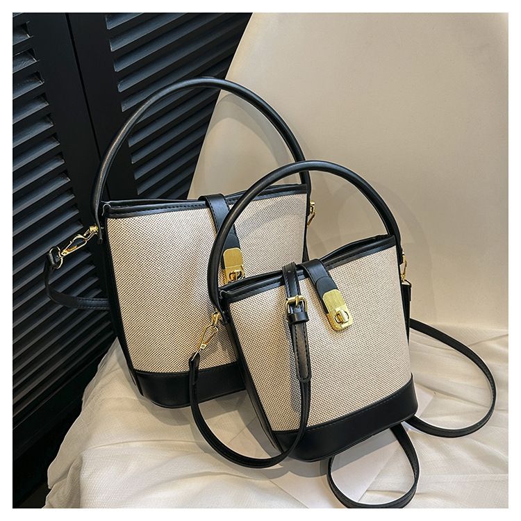 2024 nieuwe tas dames trendy en modieuze draagbare emmertas met klein ontwerp contrasterende kleur splitsen enkele schouder crossbody tas_voghion.com