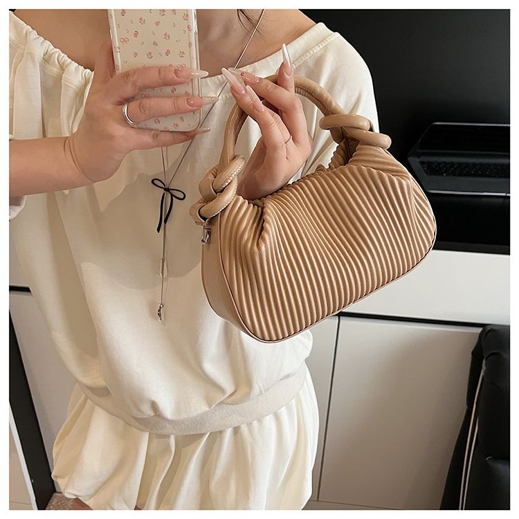 Borsa a mano a righe plissettata con personalità di nicchia per donna, borsa a secchiello versatile alla moda 2025, borsa a tracolla semplice estiva_voghion.com