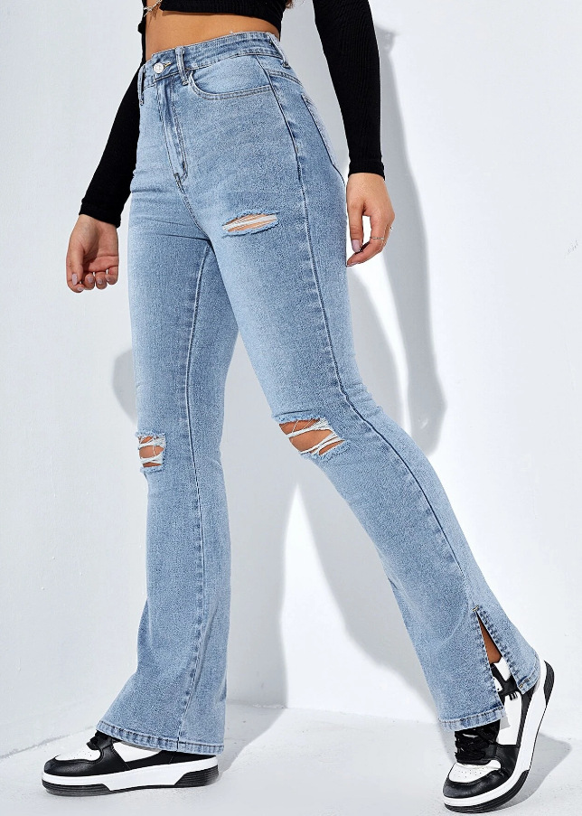 Vaqueros ajustados y elásticos con aberturas en las piernas y rotos a la moda para mujer_voghion.com