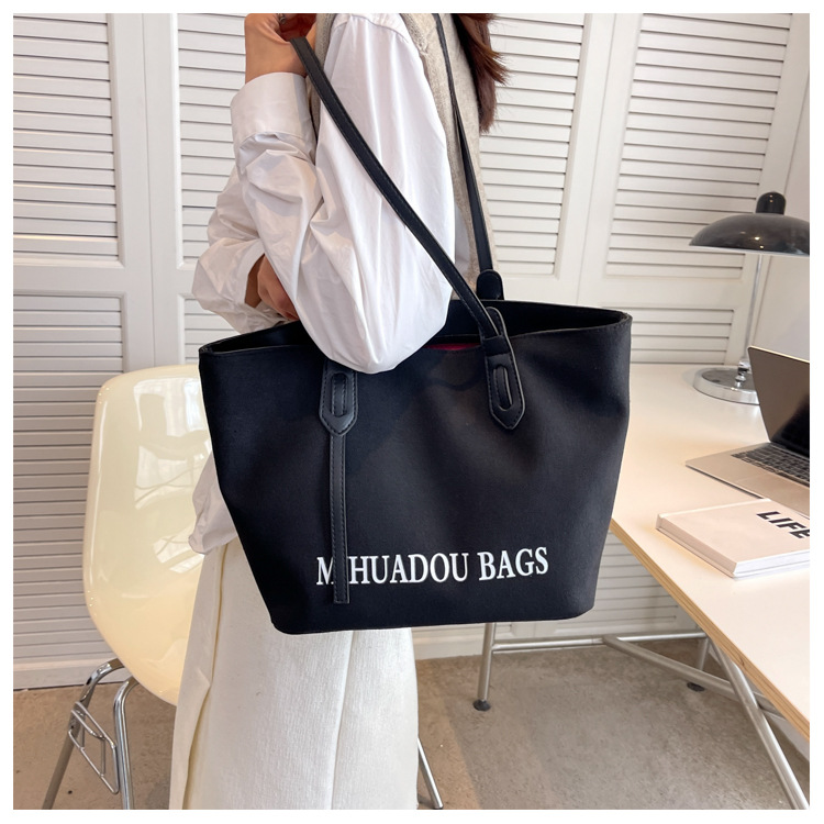 Canvas Große Damen 2023 Neue Mode Pendler Umhängetasche Einfarbig Brief Stil Urban Einfache Einkaufstasche_voghion.com
