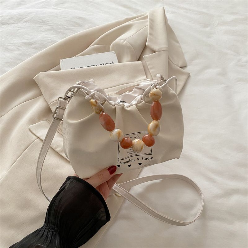 Borsa a tracolla testurizzata da donna, semplice e casual, alla moda, estiva 2025_voghion.com