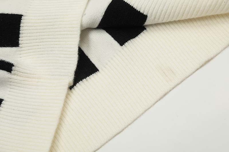 Ropa para hombre Marca de moda Jersey de punto con cuello en V y letras verticales de jacquard americano de color contrastante Suéter retro holgado y versátil para hombre_voghion.com