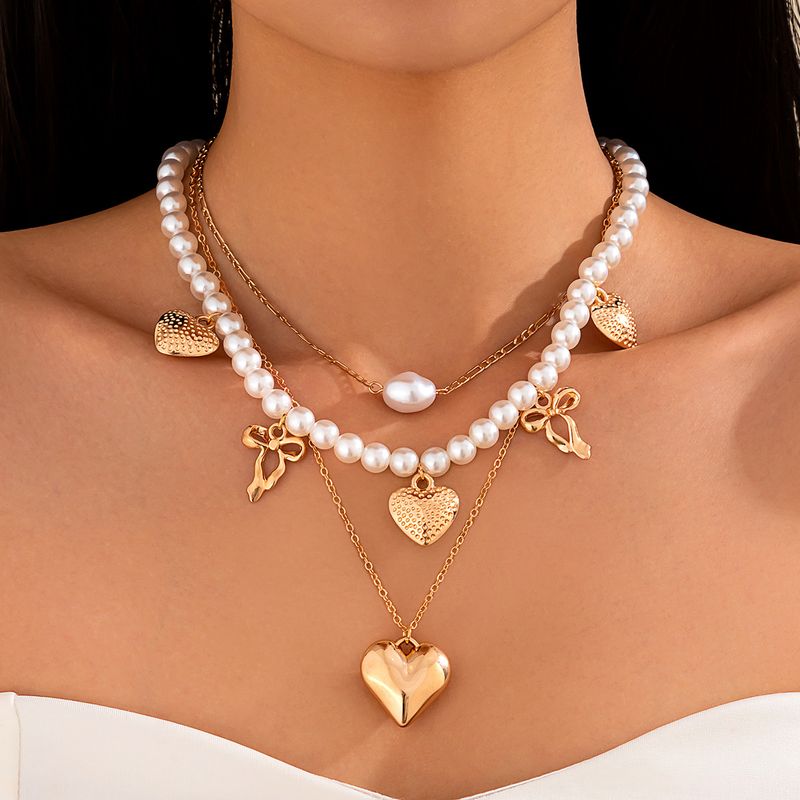 Collana da donna Collana dorata Collana con ciondolo Collana con ciondolo in lega di perle barocche dorate Choker con perline a forma di cuore Set di collane_voghion.com