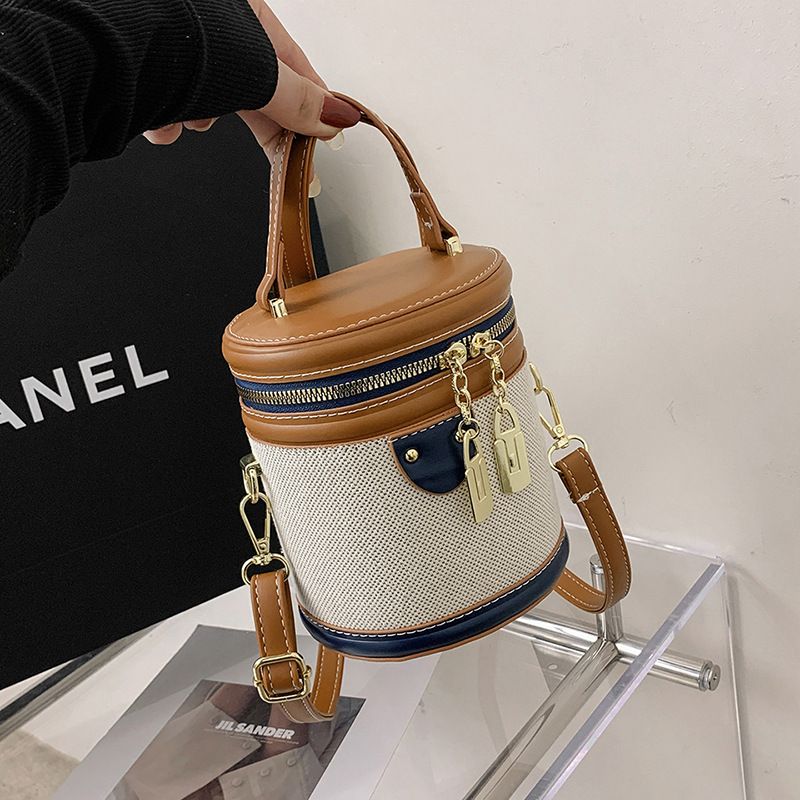 2024 New Retro Bucket Bag for Women's Handheld Fashion Contrast Color Cylinder Bag with High Appearance and Exquisite One Shoulder Crossbody Bag_voghion.com