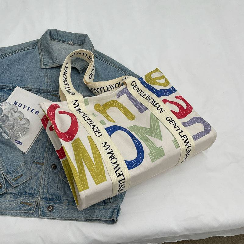 Bolso de lona a la moda para mujer, bolso grande de hombro con borla y letras, material vaquero, bolso de compras de gran capacidad para mujer_voghion.com