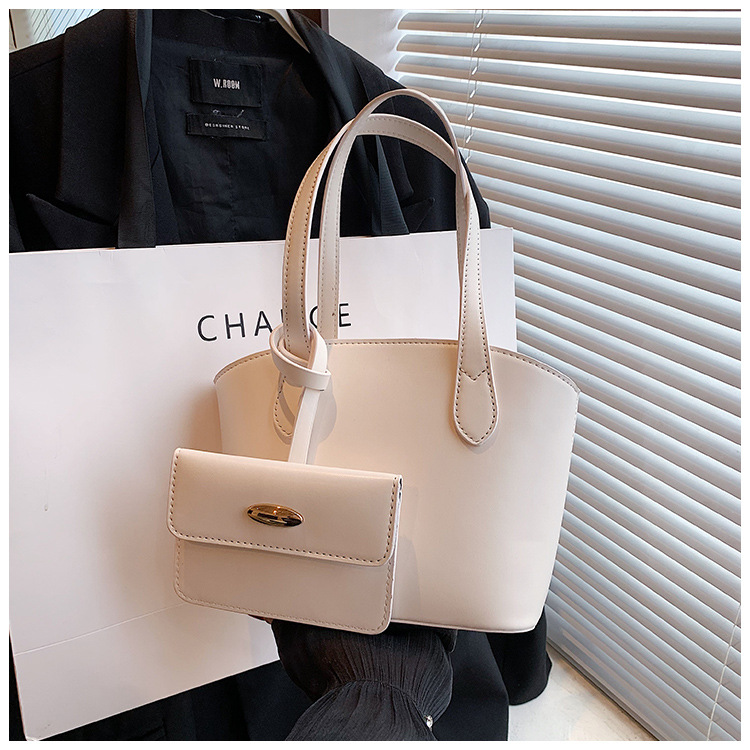 Borsa piccola portatile di moda estiva nuova borsa a secchiello casual semplice da donna 2023 borsa per ascelle suocera con trama di nicchia_voghion.com
