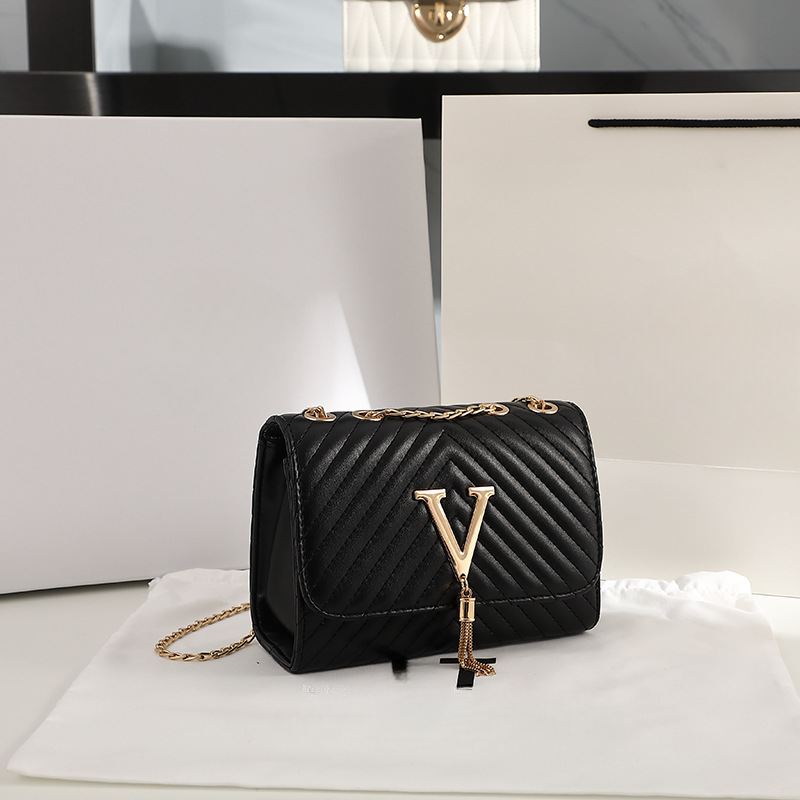 Borsa a tracolla decorativa con nappa a forma di spalla ricamata a strisce da donna alla moda 2021_voghion.com