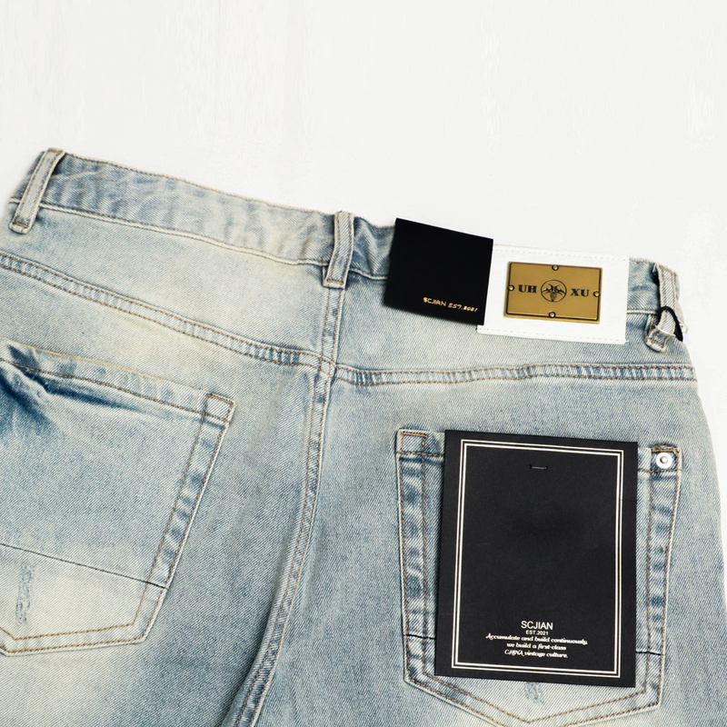 Pantaloncini in denim vintage azzurro chiaro effetto consumato per uomo - Comodi pantaloncini estivi casual in cotone elasticizzato con dettagli strappati_voghion.com