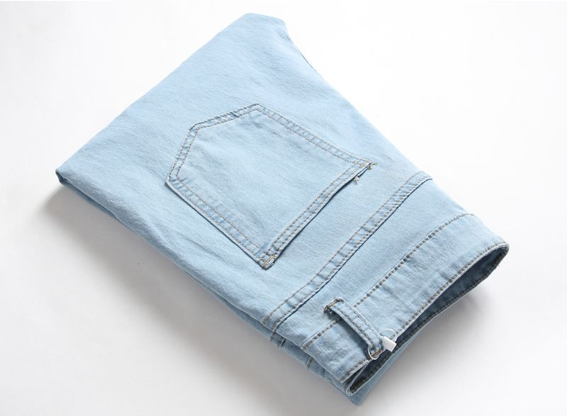 Wholesale of new white worn slim jeans for men in Europe and America_voghion.com