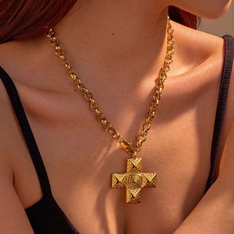 Collier INS polyvalent haut de gamme en acier inoxydable, métal titane, texture spirale et croix. Bijou_voghion.com