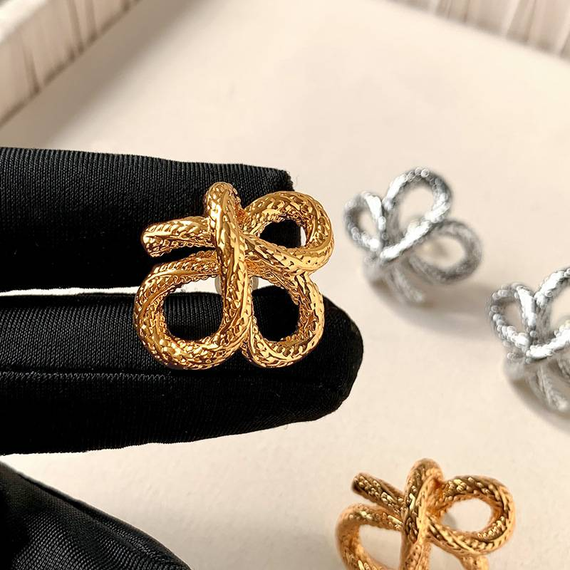 2024 new personality niche design earrings European and American French knotted twist gold earrings_voghion.com