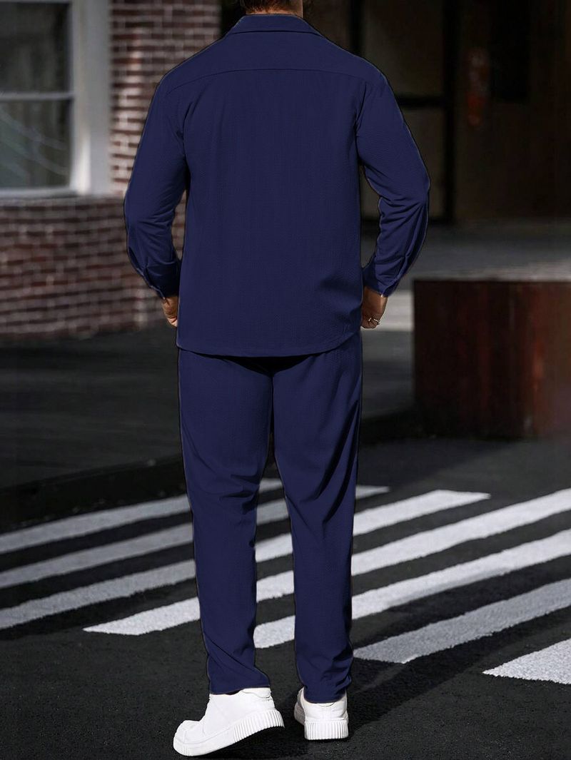 Completo sportivo casual da uomo in due pezzi con semplice giacca con risvolto, tasca con bottoni e pantaloni dritti_voghion.com