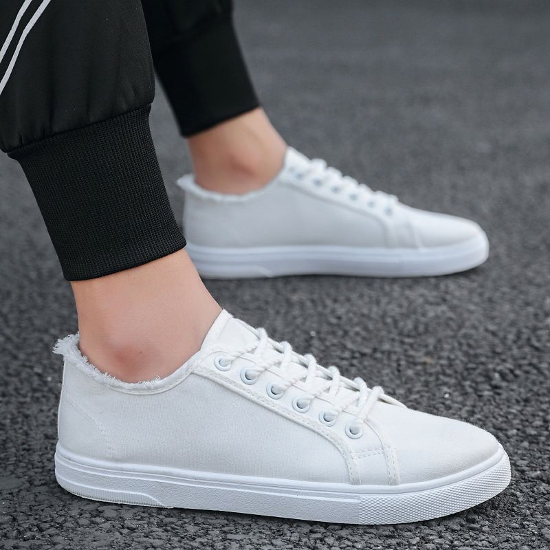 Scarpe da uomo in tela, scarpe bianche basse con suola morbida, alla moda e casual, con un solo piede, versione coreana per studenti, alla moda._voghion.com