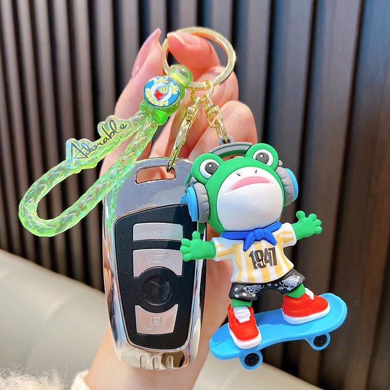Γελοιογραφία χαριτωμένη μοντέρνα κούκλα βάτραχος ανδρική και γυναικεία σχολική τσάντα μενταγιόν δώρα μπρελόκ αυτοκινήτου κρεμαστό μπρελόκ_voghion.com