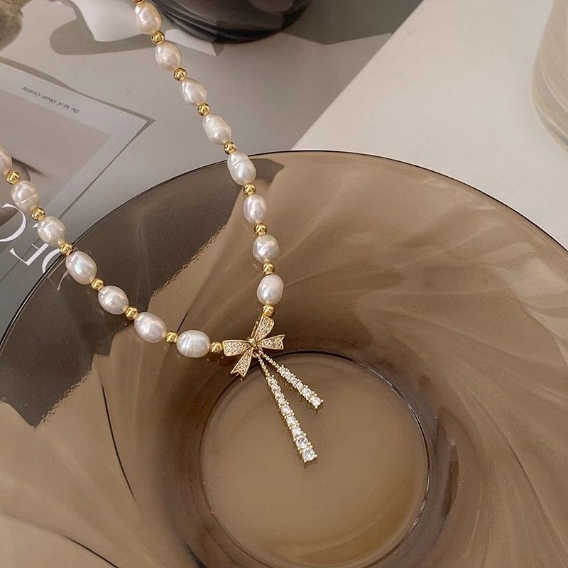 Collar de perlas con lazo para mujer, nuevo diseño moderno, ligero y lujoso, gargantilla de cadena de clavícula con temperamento de celebridad de Internet de alta gama_voghion.com