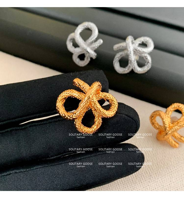 2024 new personality niche design earrings European and American French knotted twist gold earrings_voghion.com