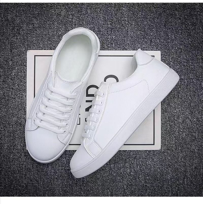 Uformell sport for menn Hvite mote flats 2024 Nye designersneakers Herre ensfargede tennissko Zapatillas Hombre_voghion.com