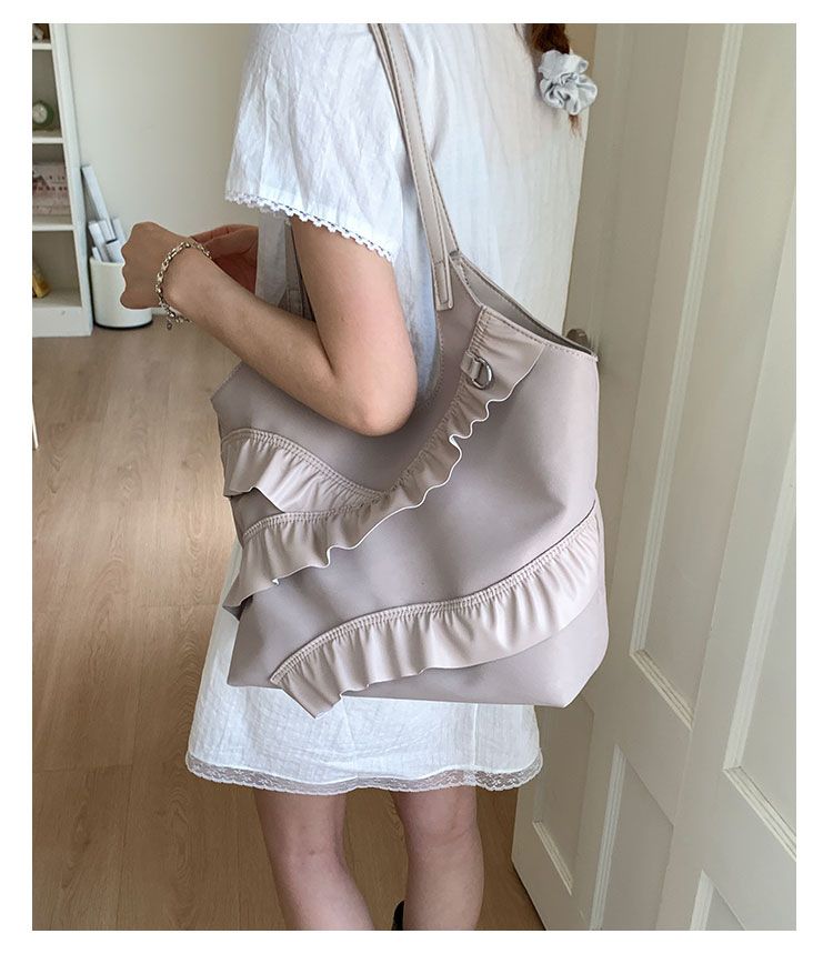 Borse alla moda di quest'anno 2025 Nuova versione coreana Moda Foglia di loto Versatile Spalla Donna Grande capacità Portatile_voghion.com