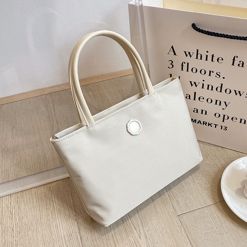 2022 Sommer Neue Canvas Handheld Mini Tote Mode Einfache Pendler Damentasche_voghion.com