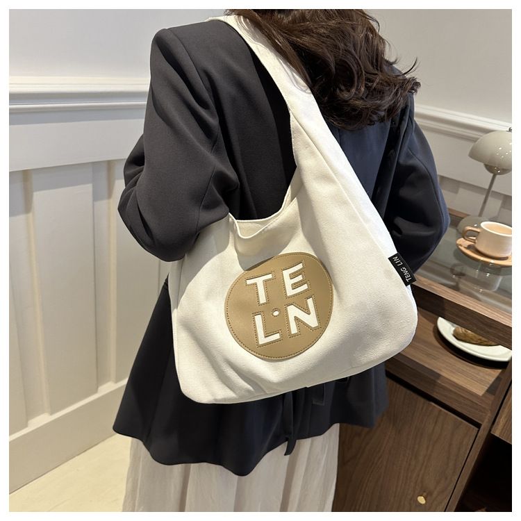 2024 Primavera Nuova Bellissima Borsa Tote in Tela Personalizzata Grande Capacità Moda Donna Borsa a Tracolla Singola per Pendolari_voghion.com