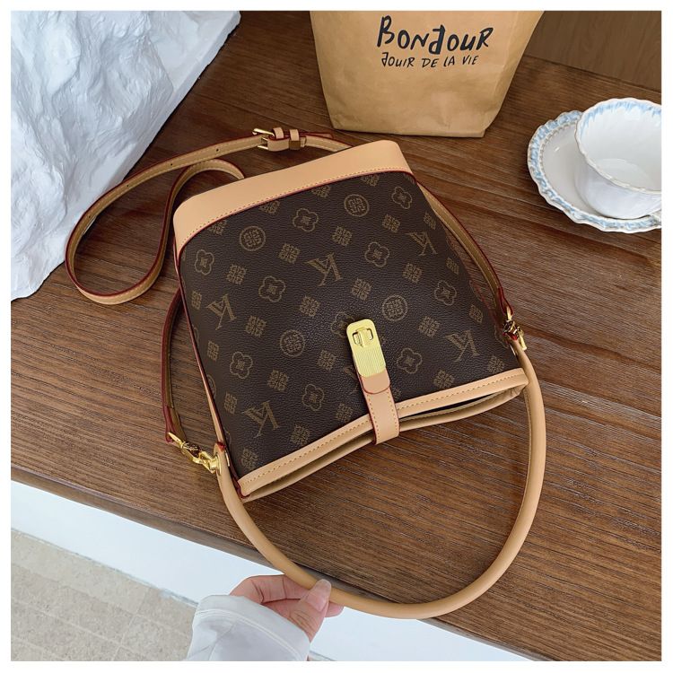 Tendenza di quest'anno: borsa a secchiello leggera e lussuosa stampata per le donne, nuova borsa alla moda 2025, borsa a tracolla versatile_voghion.com